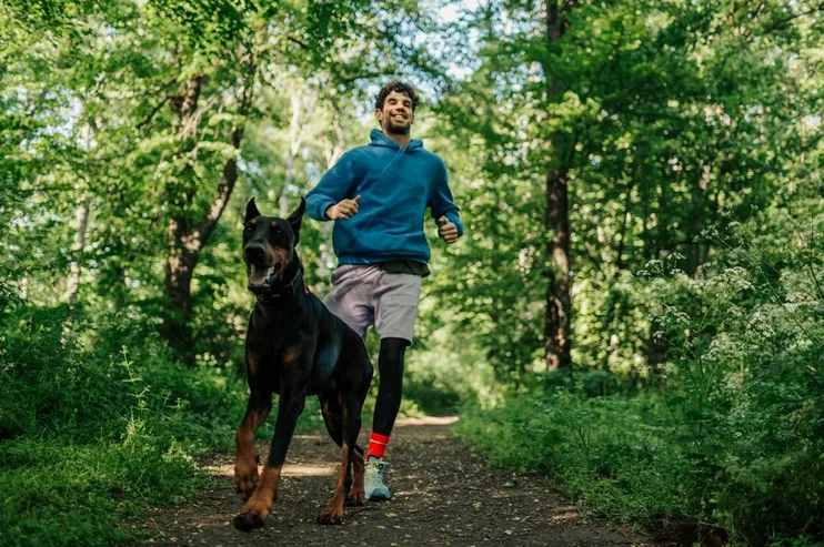 man with dog outdoors
